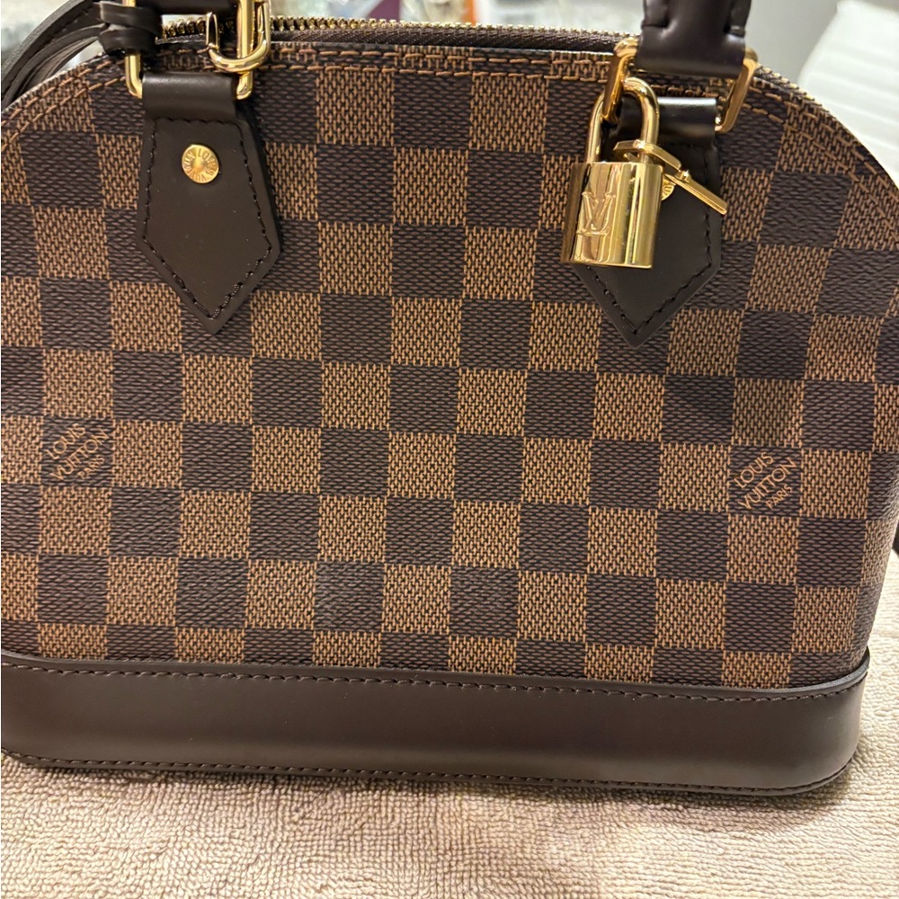 Authentic Louis Vuitton crossbody bag (brown) worn once still like new.